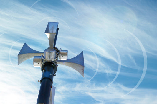 security-alarm-going-off-outside-with-clouds-in-sky