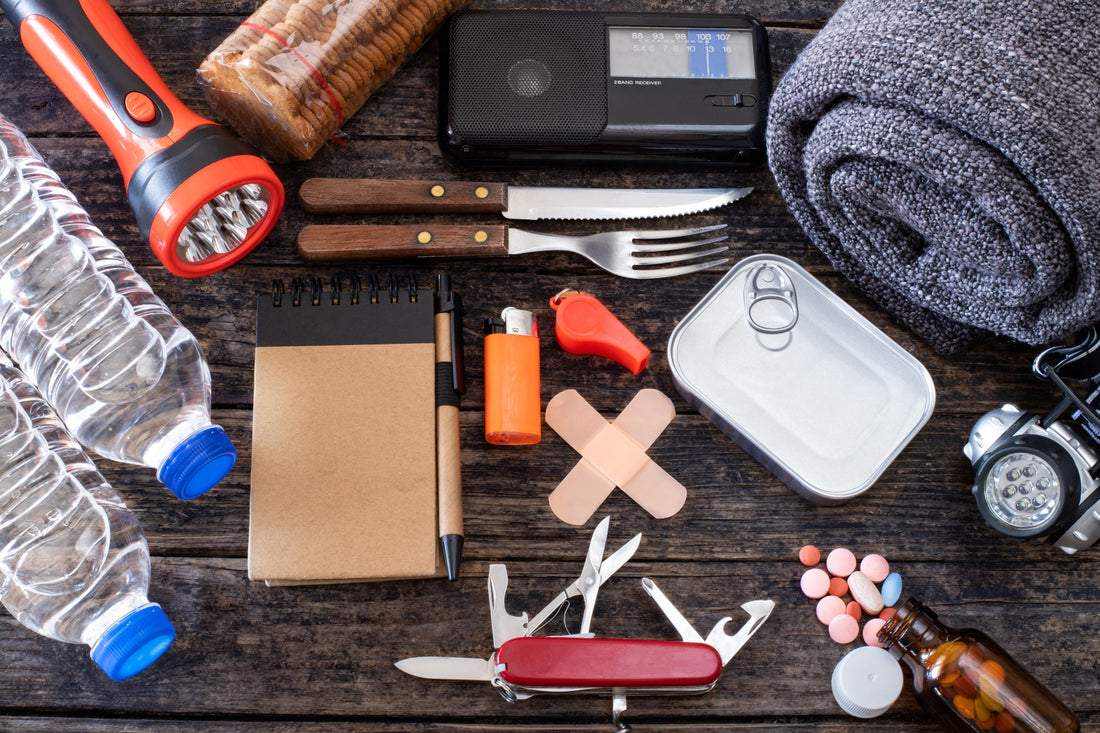 Emergency Preparedness Go Bag Essential Spread Across A Table