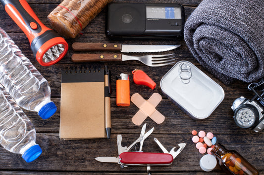Emergency Preparedness Go Bag Essential Spread Across A Table
