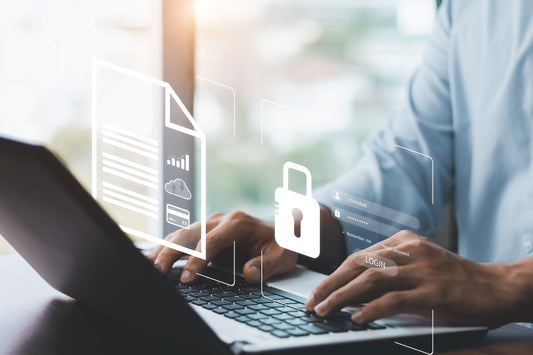 man using computer with an overlay of cyber security